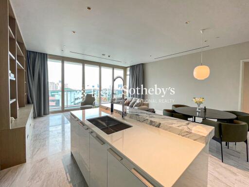 Modern living area with kitchen island and dining space