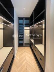 Walk-in closet with shelving and drawers