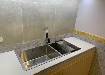 Modern kitchen with dual sinks and a minimalist design