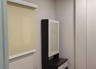 Bedroom with air conditioner and vanity desk