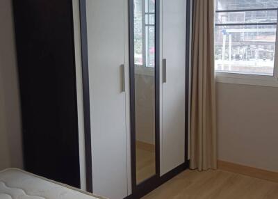 Bedroom with wardrobe and window