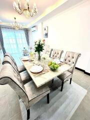 Elegant dining area with plush chairs and a well-set table