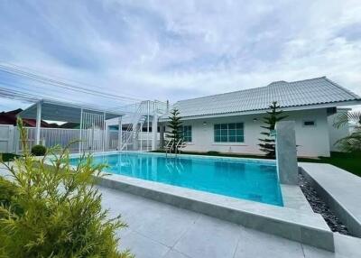 Outdoor area with swimming pool and modern house