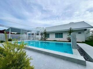 Outdoor area with swimming pool and modern house