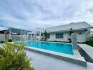 Outdoor area with swimming pool and modern house