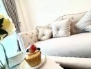 Living room with white couch and decorative pillows