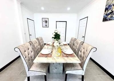 Elegant dining room with a marble table and six chairs