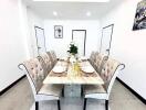 Elegant dining room with a marble table and six chairs