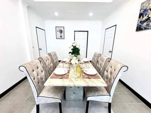 Elegant dining room with a marble table and six chairs