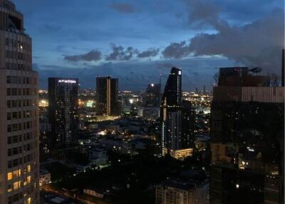 City skyline view at dusk from a high-rise building