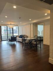 Spacious living room with modern furniture and large windows