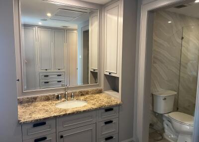 Modern bathroom with marble countertop and shower