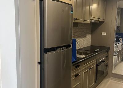 Modern kitchen with stainless steel appliances and ample cabinetry