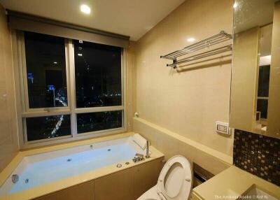 Modern bathroom with large window and a view