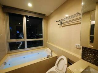 Modern bathroom with large window and a view