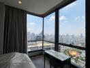 Bedroom with large windows offering a city view