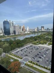 View of the city skyline and river from high-rise window