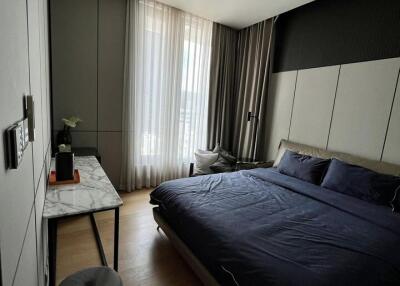 Modern bedroom with large window and natural light