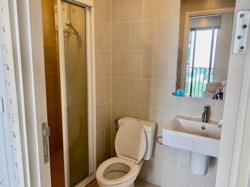 Bathroom with shower, toilet, and sink