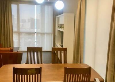 Modern dining area with wooden table and chairs