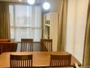 Modern dining area with wooden table and chairs