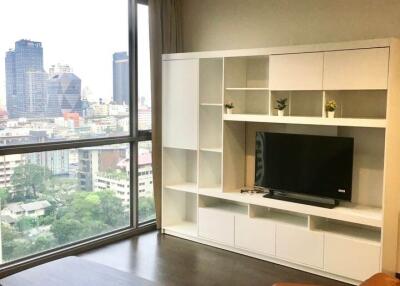 Modern living room with large window and city view