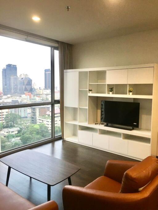 Modern living room with large window and city view