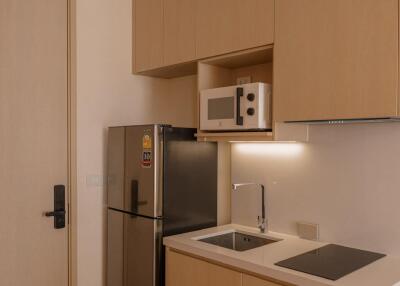 Modern kitchen with wooden cabinets and appliances