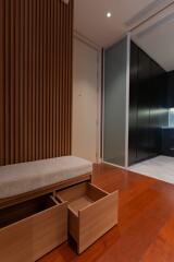 modern hallway with wooden accents and storage bench