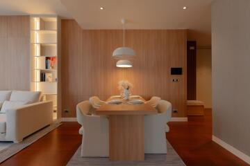 Modern dining room with wooden accents and contemporary lighting