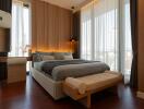 Modern bedroom with large windows and stylish decor