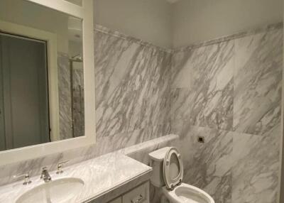 Modern bathroom with marble walls and floor