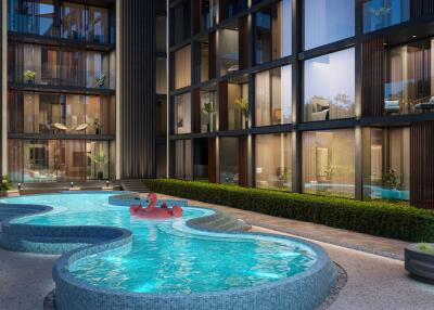 Modern condominium building with a stylish outdoor pool area