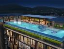 Rooftop swimming pool with lounge area at night