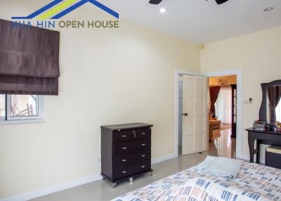 Bedroom with furniture and ceiling fan