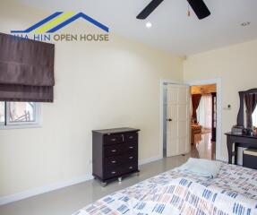 Bedroom with furniture and ceiling fan