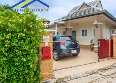 Exterior view of a house with a car parked in the driveway