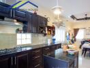 Modern kitchen featuring dark wood cabinets and a kitchen island