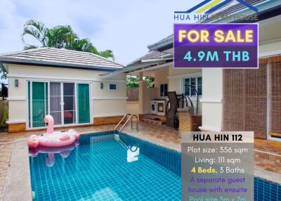 House with swimming pool and for sale sign