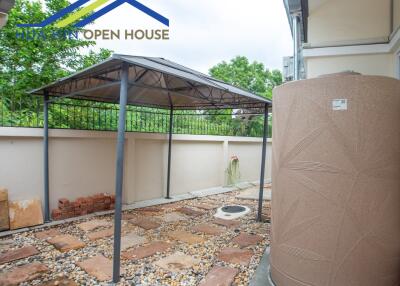 Outdoor area with canopy and water tank