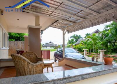 Outdoor patio with seating area and driveway