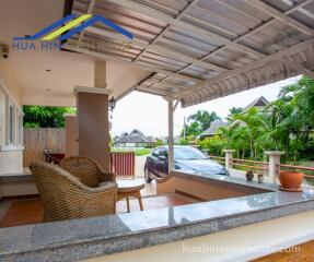 Outdoor patio with seating area and driveway