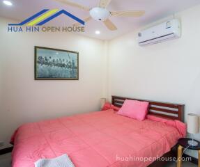 Bedroom with air conditioning and art decoration