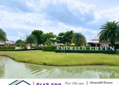 View of Emerald Green residential area facade with landscaped garden and water feature