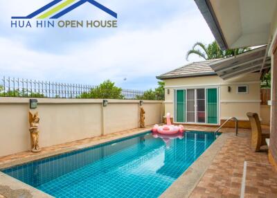 Private swimming pool with lounging area