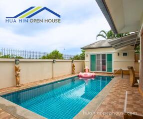 Private swimming pool with lounging area