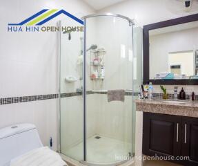 Modern bathroom with glass shower and vanity