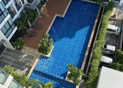 Aerial view of an apartment complex with swimming pool