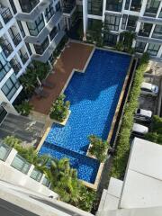 Aerial view of an apartment complex with swimming pool