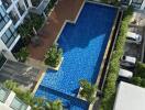 Aerial view of an apartment complex with swimming pool